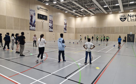 A practical sport session delivered to local young people, delivered with IntoUniversity 